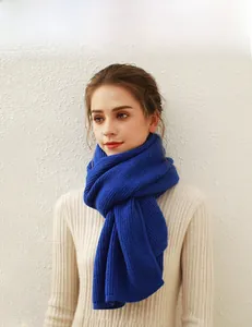 Close-up of royal blue chunky ribbed knit scarf showcasing thick texture and warmth