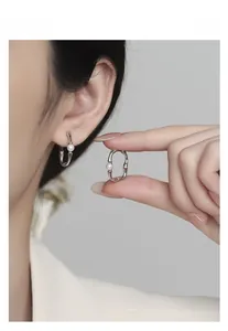 Detailed macro view of S925 silver bamboo joint hoop earring featuring a white shell pearl