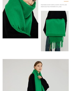 Detail of soft mohair feel scarf in vibrant green with thick tassels and knit texture