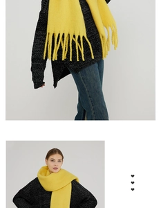 Detailed close-up of thick yellow mohair scarf featuring classic long tassels and soft texture