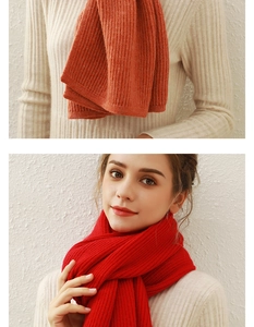 Detail of red knit scarf with vertical ribbed texture and soft cashmere-like fabric