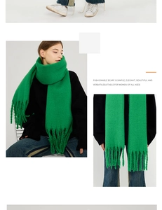 Detail of bright green knitted scarf with long tassels and thick fuzzy mohair texture