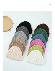 Matrix display of knitted wool beanies in various solid colors and ribbed textures