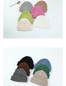 Flat lay display of various solid color wool knit beanies with ribbed texture