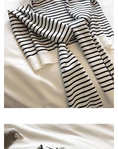 Detail of soft black and white striped knit shawl with long matching ties for styling