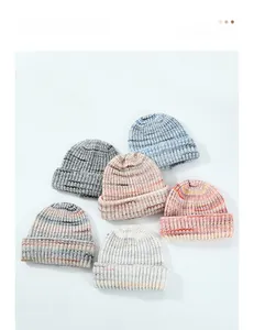 Detail shot of multicolor wool knit beanies showing ribbed texture and various color options
