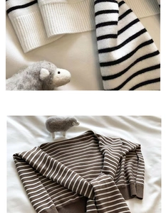 Close-up of classic striped knit fabric texture with ribbed collar detailing in two colors