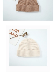Detailed view of ribbed wool knit beanies in light brown and beige colors for winter