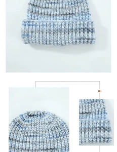 Close-up of knit wool beanie showing mixed blue and grey marl texture and cuffed edge