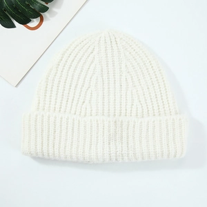 Minimalist white wool knit beanie featuring high-quality ribbed texture for winter warmth