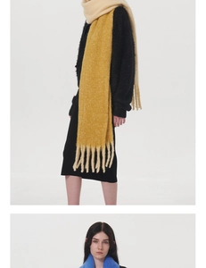 Close-up of soft two-tone cashmere-like scarf with fringe details and fluffy mohair texture
