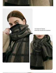 Detail of thick winter knit scarf with classic black and brown plaid pattern texture