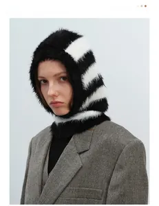 Detailed texture of black and white striped faux mink fur balaclava hood scarf