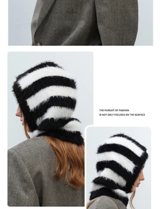 Detail of plush black and white striped balaclava hood with soft faux fur texture