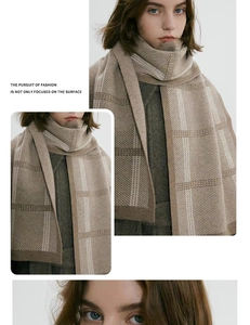 Detail shot of the soft knitted thick plaid scarf in earthy beige and brown color tones