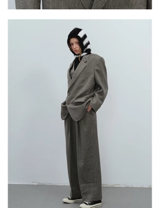 Detail of grey vintage oversized suit jacket with classic lapel and textured fabric