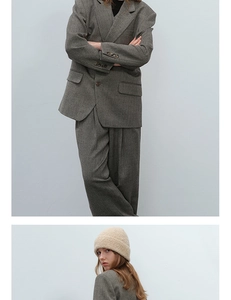 Close-up of thick beige textured wool knit beanie paired with a grey oversized blazer