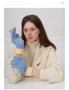 Detail of wool knit touch screen gloves in light blue with contrasting yellow ribbed cuffs