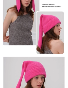 Detail of hot pink ribbed knit beanie with long pointed bunny ears for women