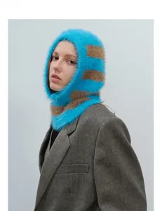 Close-up of plush blue and brown striped faux mink fur balaclava hood texture