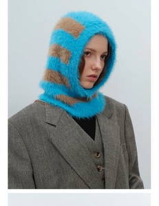 Detail of striped blue and brown faux mink fur balaclava with soft fluffy texture