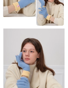 Detailed knit texture of wool-blend gloves with blue and yellow contrasting ribbed cuffs