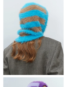 Detail view of striped faux fur balaclava showing thick knit texture and plush material