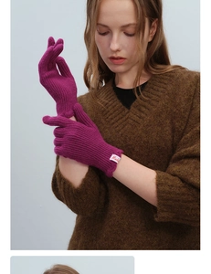 Detailed knit texture of magenta wool blend fingerless gloves with Mula brand label