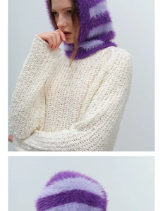 Detail of faux mink fur balaclava with purple stripes and chunky knit texture