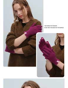 Close-up of purple ribbed knit fingerless wool gloves with functional touch opening