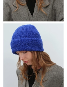 Close-up of Klein Blue bouclé wool beanie showing fuzzy texture and warm knitted fabric