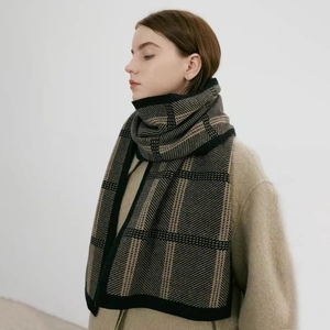 Classic black and khaki plaid knit scarf for winter with a thick wool texture