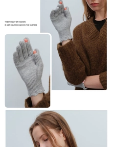 Detail of grey wool knit glove showing ruffles and touchscreen opening on finger