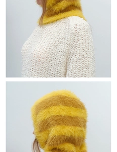 Close-up of striped faux mink balaclava in yellow and golden brown with plush texture