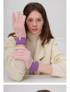 Detail showing soft pink and purple wool blend knit gloves with ribbed cuffs and tag