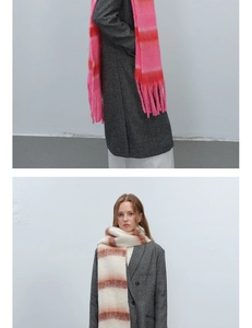 Detail of thick striped gradient knit scarves with long tassels and soft mohair texture
