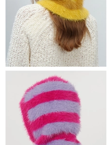 Detail of soft fuzzy knit Balaclava hat in ginger yellow and pink striped faux mink fur