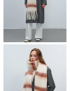 Detail of soft striped faux mohair scarf with plush tassels for winter warmth