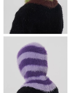 Macro detail of plush faux mink fur texture on a winter balaclava knit hat with patchwork design