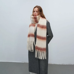 Thick warm winter scarf with brick red stripes and long tassels on cream base