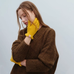 Women's yellow wool-blend ribbed knit fingerless gloves with a fashionable brand label