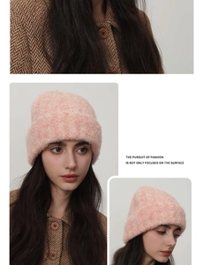 Detailed close-up of pink knit beanie made of warm mohair blend for winter style
