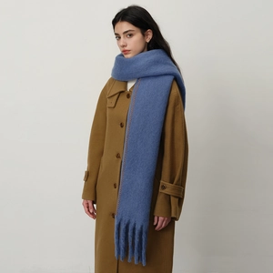 Thick cashmere-feel scarf in blue with orange contrast stitching and fringe tassels