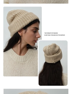 Detailed knit texture of beige wool blend beanie with cuffed design for winter