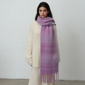 Retro blue and red plaid scarf with long tassels and plush texture on white sweater