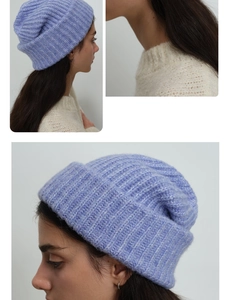 Close-up of lavender chunky knit beanie showing the soft wool blend texture and fold-up cuff