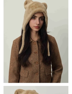 Detailed texture of plush cat ear hat paired with retro brown herringbone wool blazer