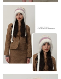 Detail of plush gradient knit trapper hat with faux fur trim and long braided tassels