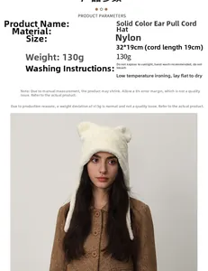 Detailed view of white faux fur winter hat with cute ears and nylon fabric specs