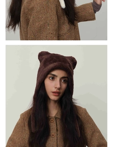 Close-up of soft dark brown plush cat ear knit hat for winter warmth and fashion style